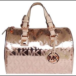 MK metallic gold rose in excellent condition